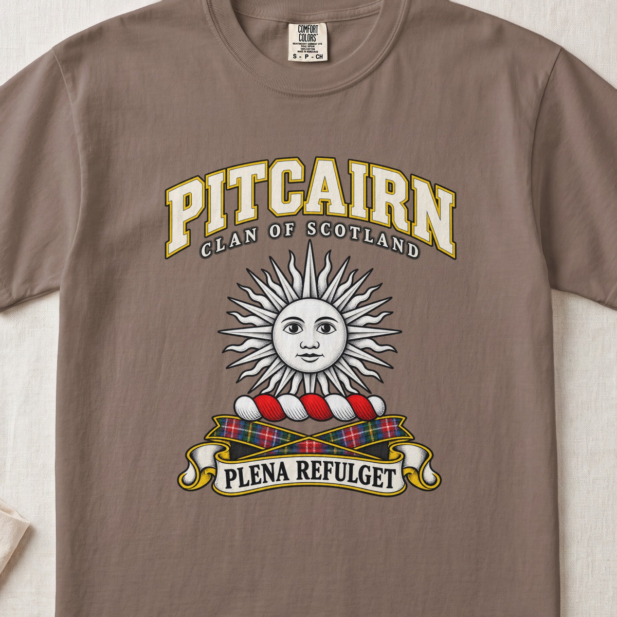 Pitcairn Scottish clan T-shirt in Espresso, front view with a silver sun with a face and motto design.