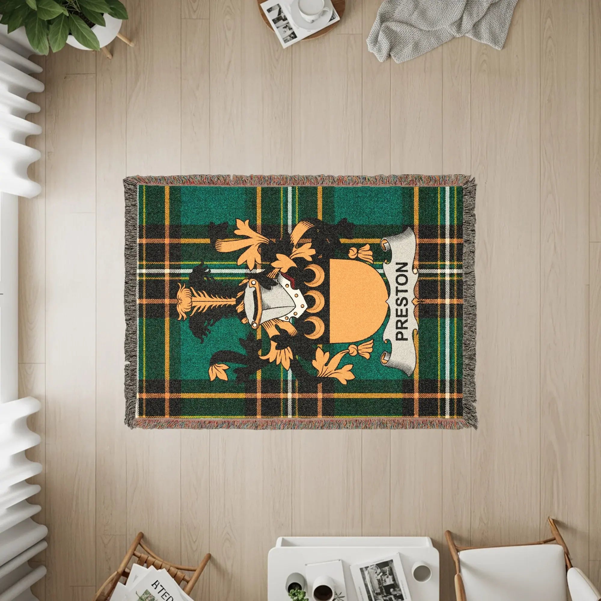 Green plaid woven throw blanket with Preston family crest.