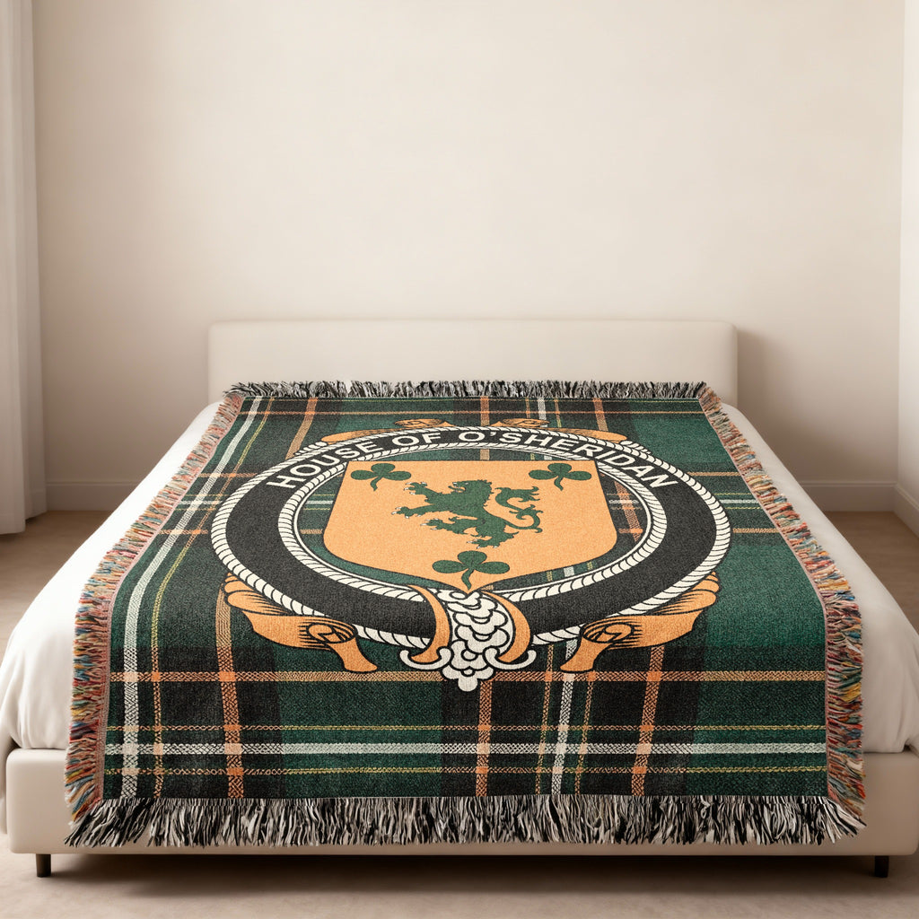 O'Sheridan family crest emblem woven blanket displayed on a bed