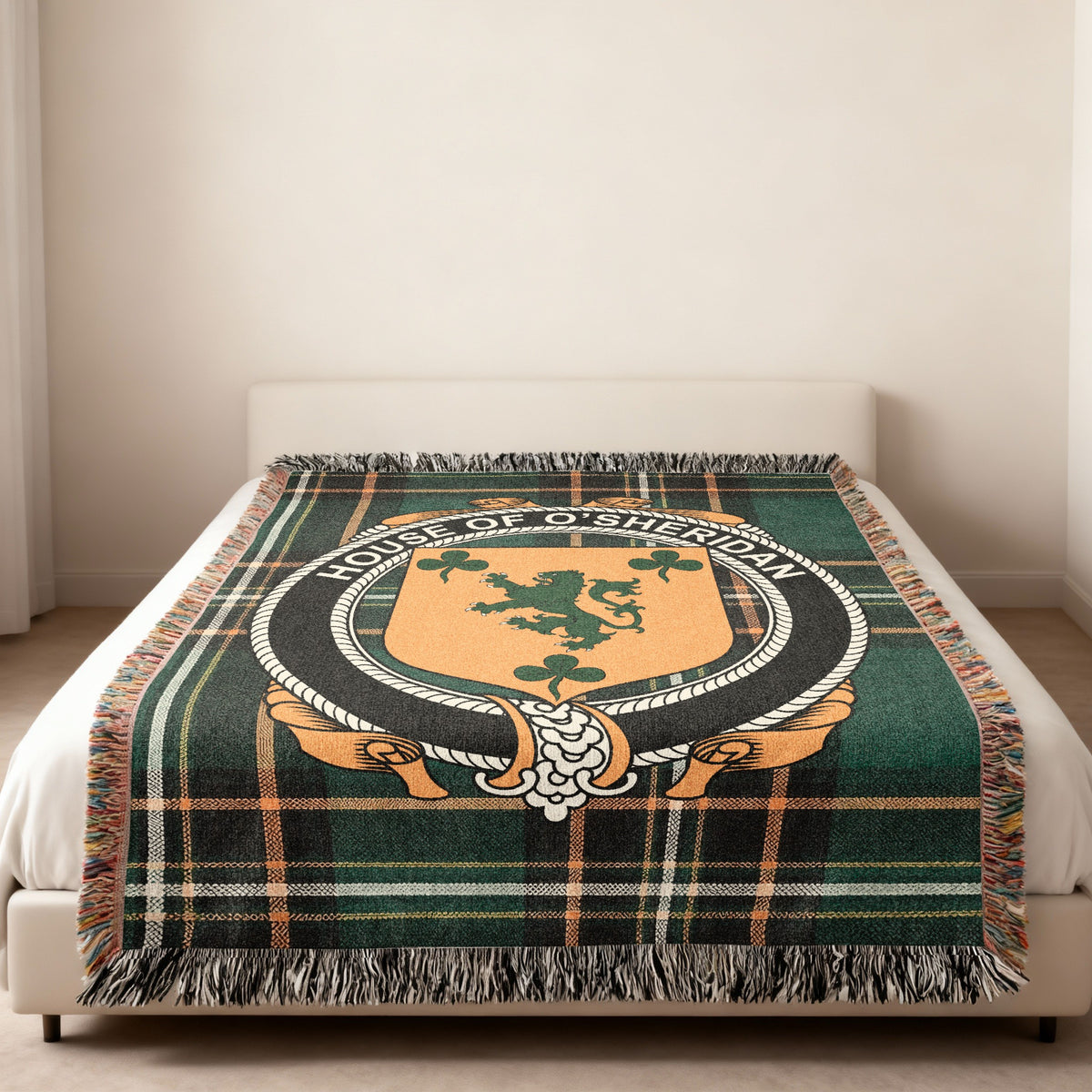 O'Sheridan family crest emblem woven blanket displayed on a bed