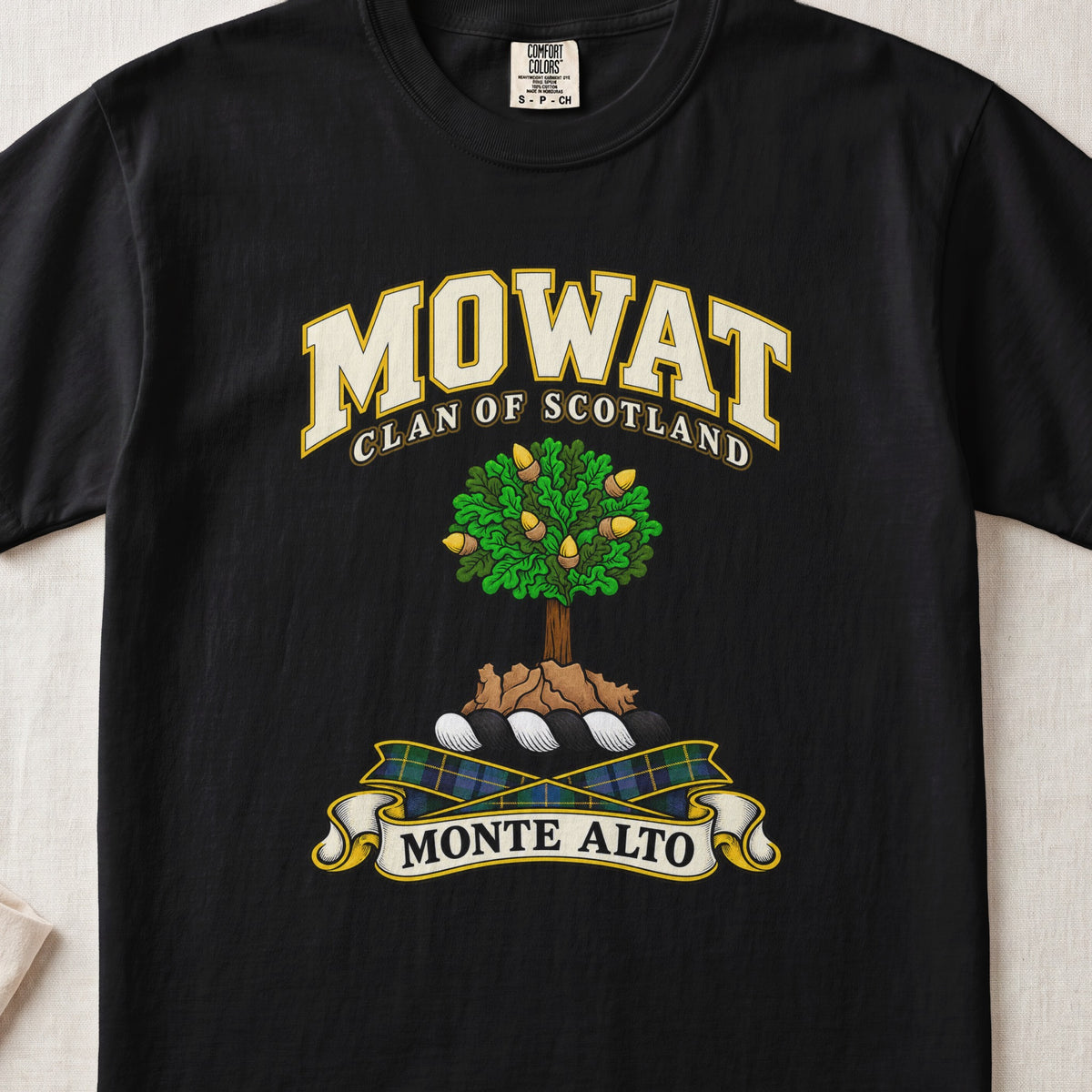 Mowat Scottish clan T-shirt in Black, front view with a green tree on a rocky mound and motto design.