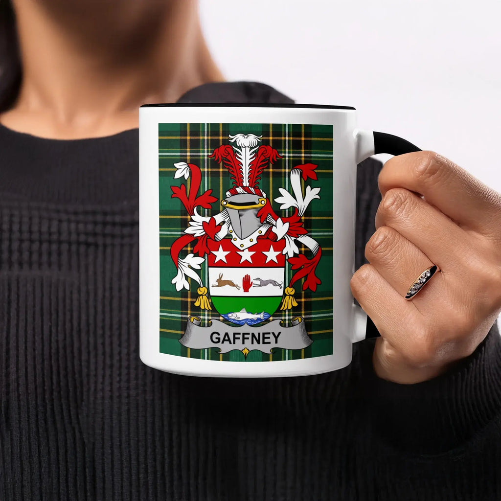 Black mug with Gaffney family crest on a plaid background.