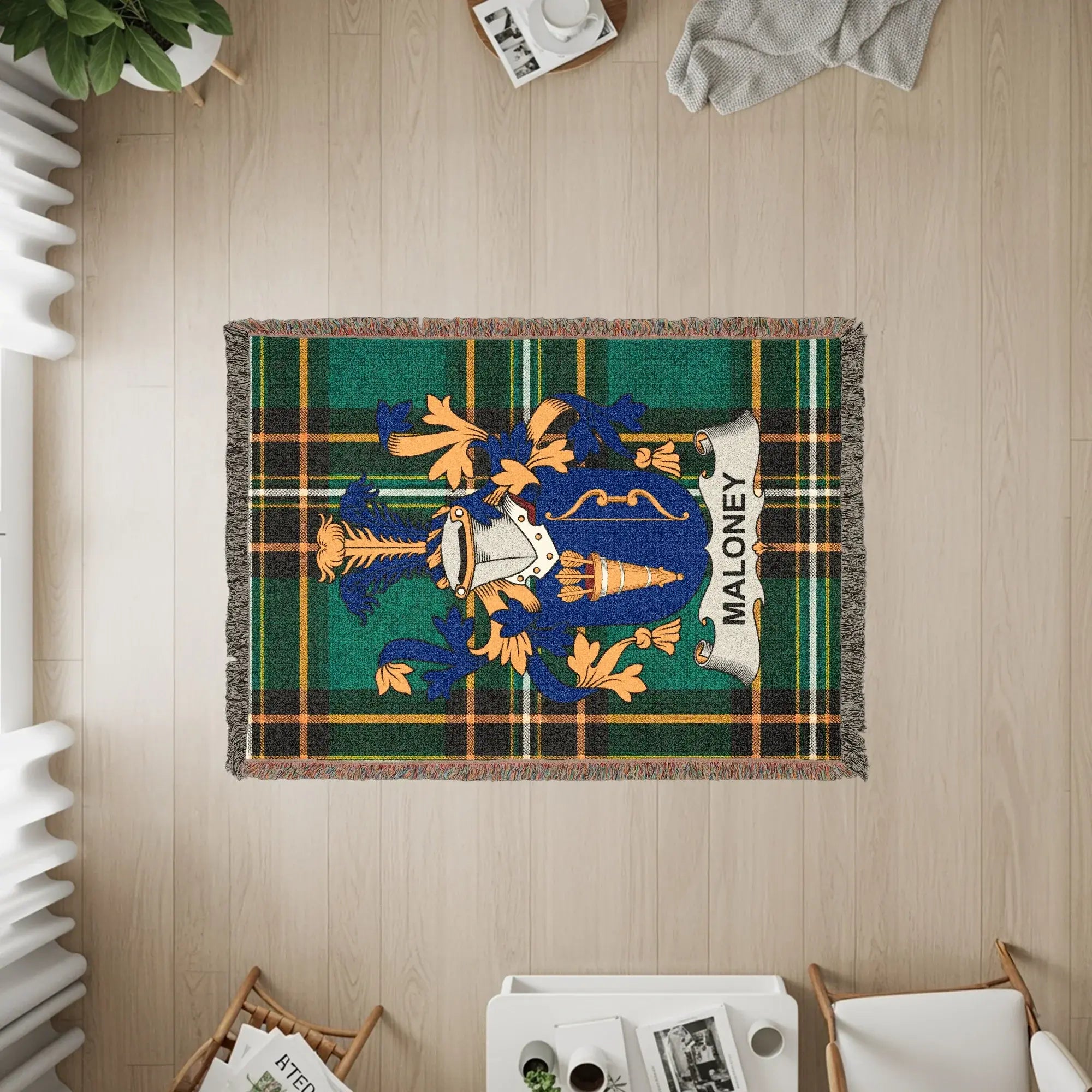 Maloney tartan woven blanket with family crest displayed.