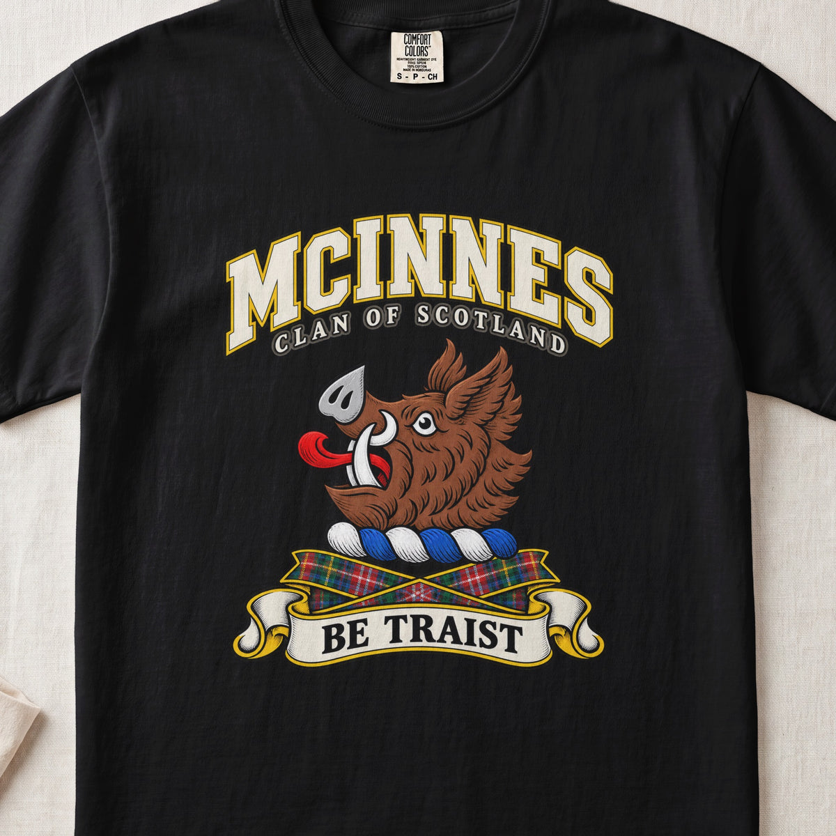 McInnes Scottish clan T-shirt in Black, front view with a brown boar head and motto design.