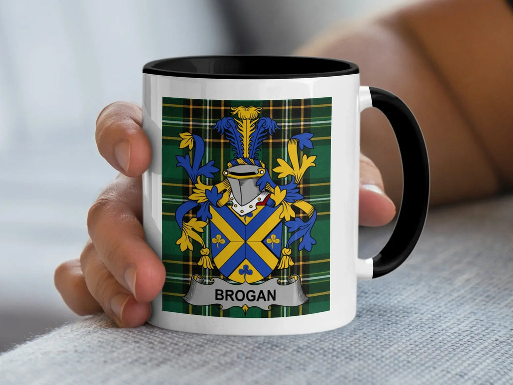 White mug with black rim featuring a Scottish tartan design and the surname Brogan.