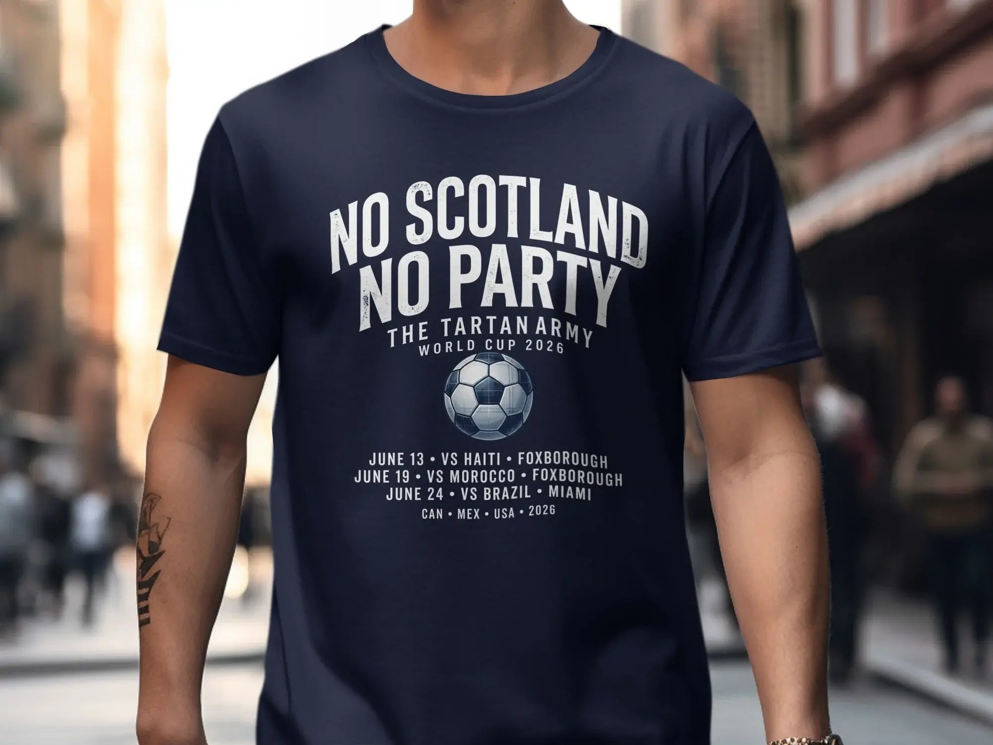 Navy t-shirt with "No Scotland" and 2026 World Cup match schedule.