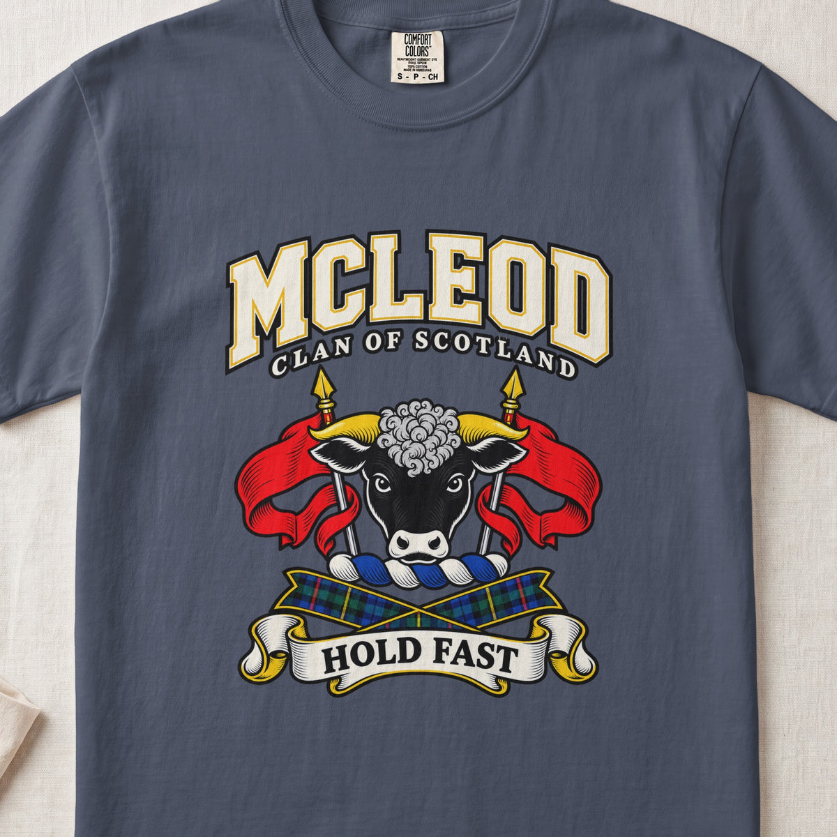 McLeod graphic T-shirt in Midnight blue, front flat lay showing varsity lettering and black bull head with white muzzle and curly white forelock.