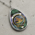 Beveridge clan Scottish tartan necklace with clan crest on tartan background