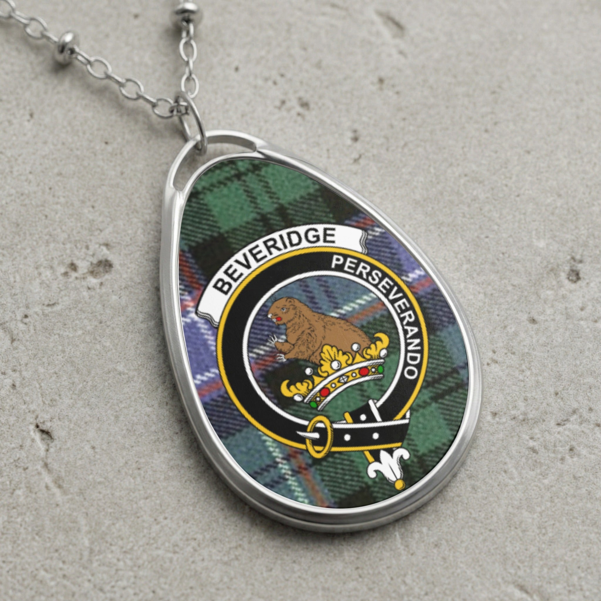 Beveridge clan Scottish tartan necklace with clan crest on tartan background