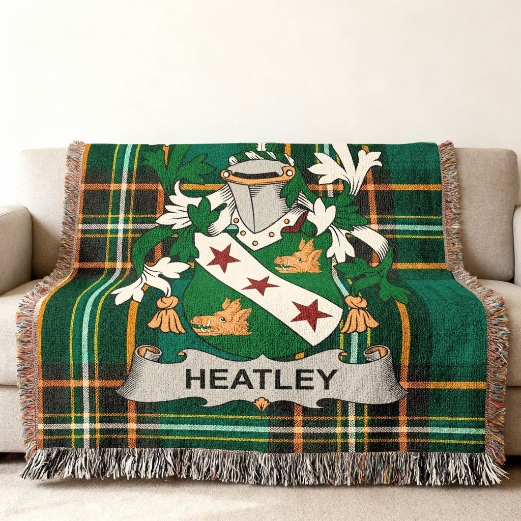 Green tartan throw blanket with a coat of arms featuring the name "Heatley".