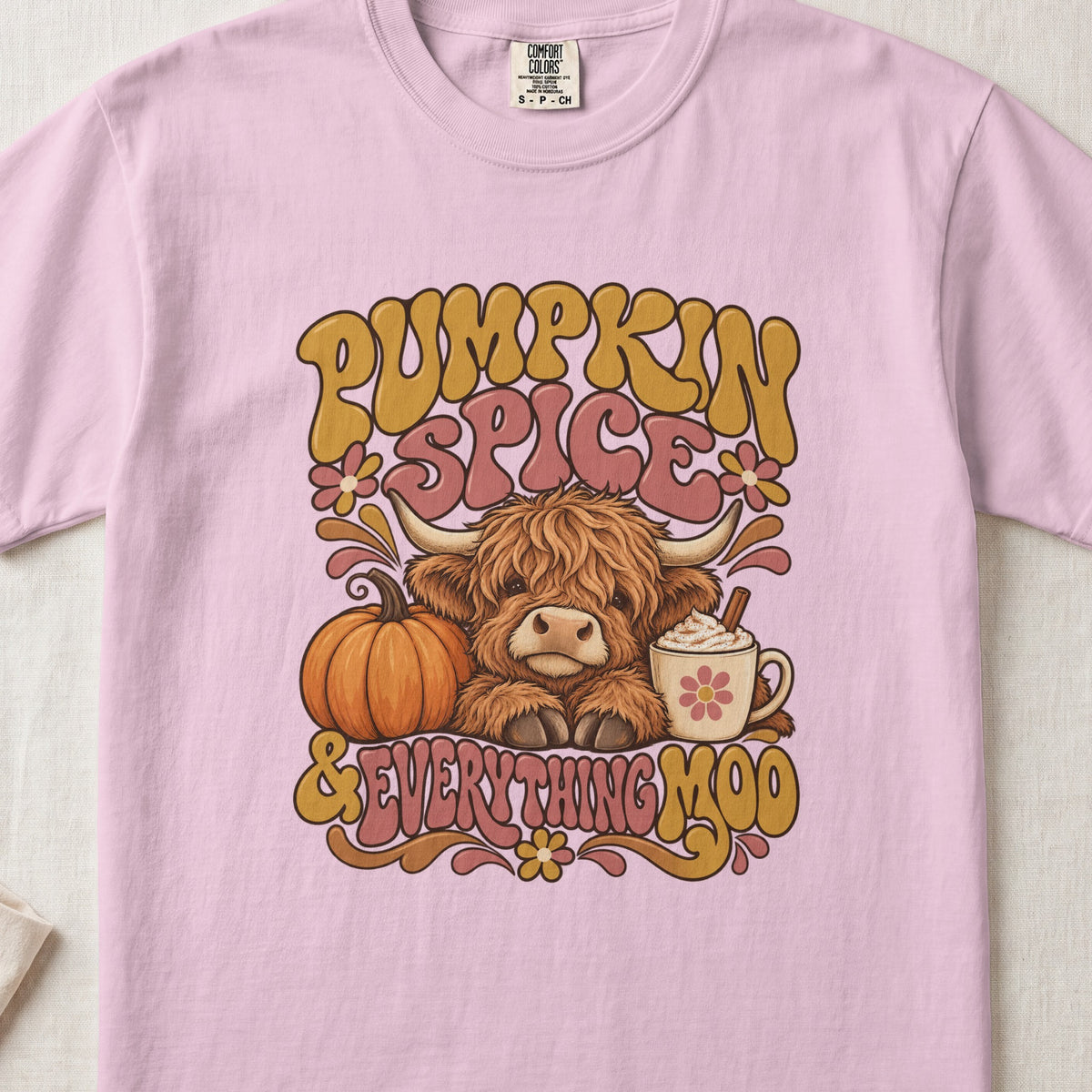Pumpkin Spice & Everything Moo Highland cow design on a Blossom Comfort Colors 1717 T-shirt, flat lay