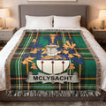 McLysaght tartan blanket with family crest on a bed.