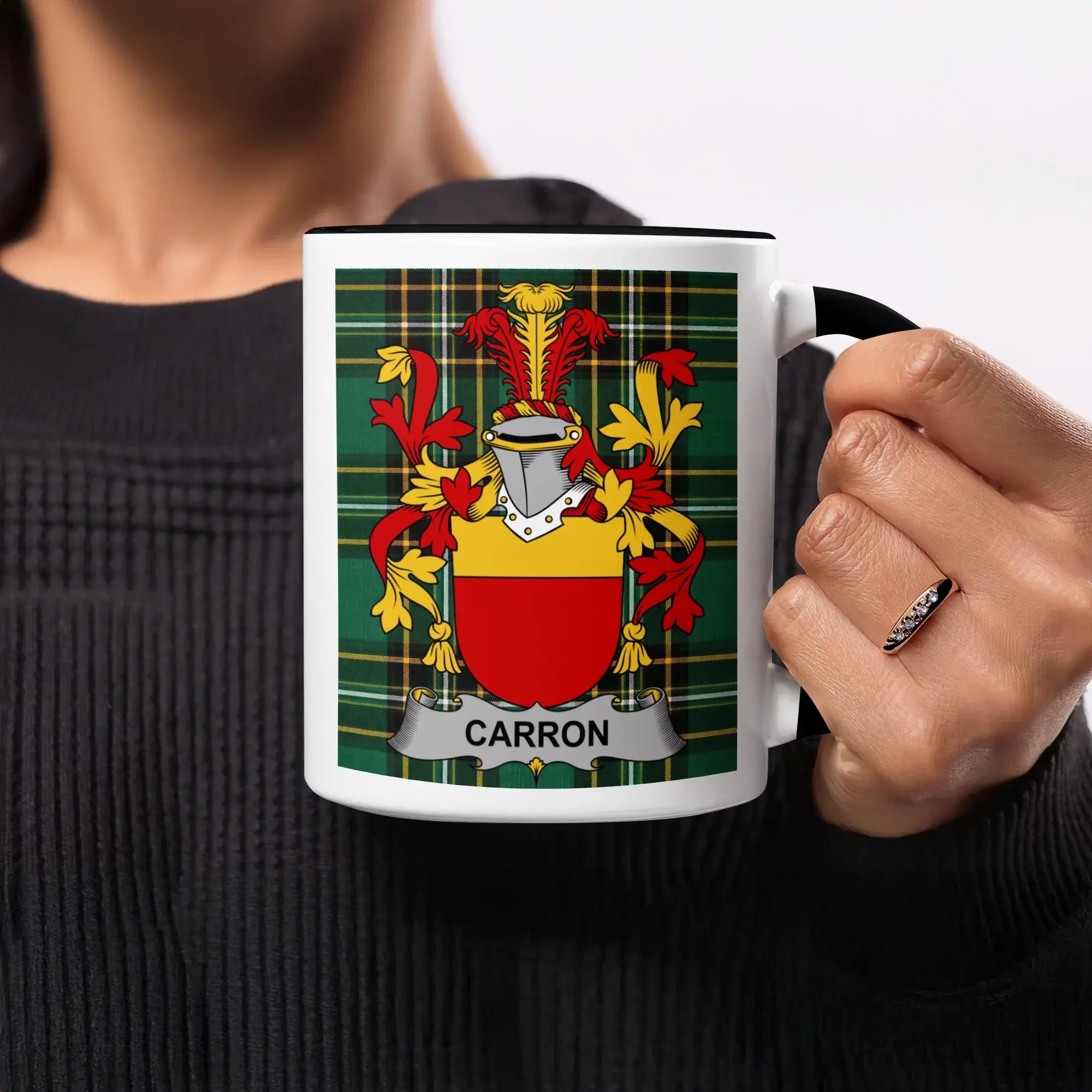 Mug with Carron coat of arms on green tartan background.