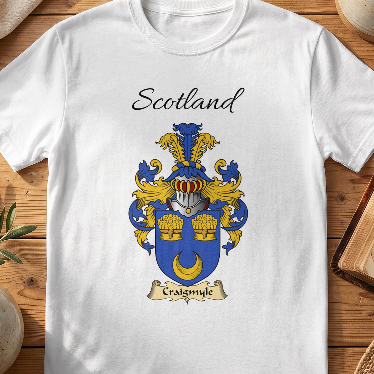 White Craigsmyle Scottish family shield T-shirt featuring a gold crescent beneath two gold sheaves on blue