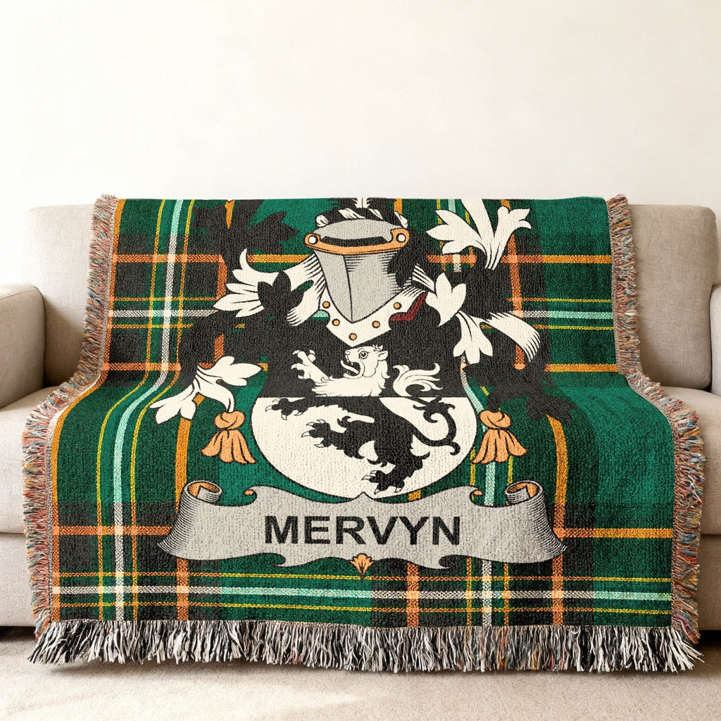 Green plaid throw blanket with Mervyn family crest.