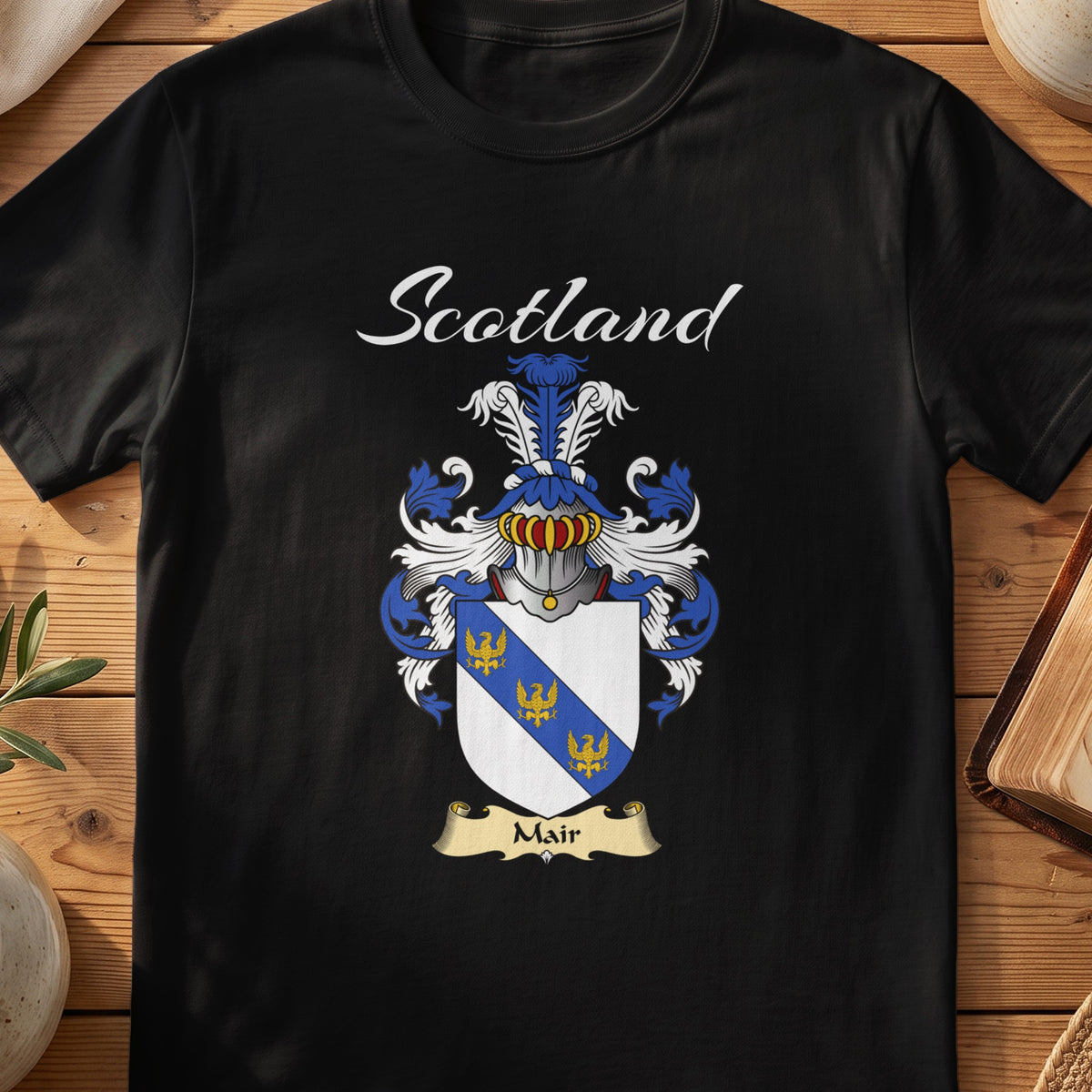 Black Mair Scottish T-shirt featuring a blue diagonal band with small gold motifs