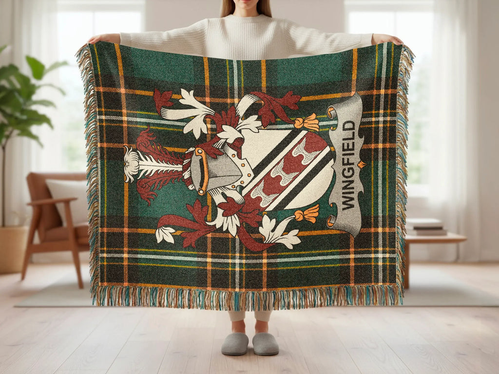 Tartan blanket featuring a coat of arms with "Wingfield" text.