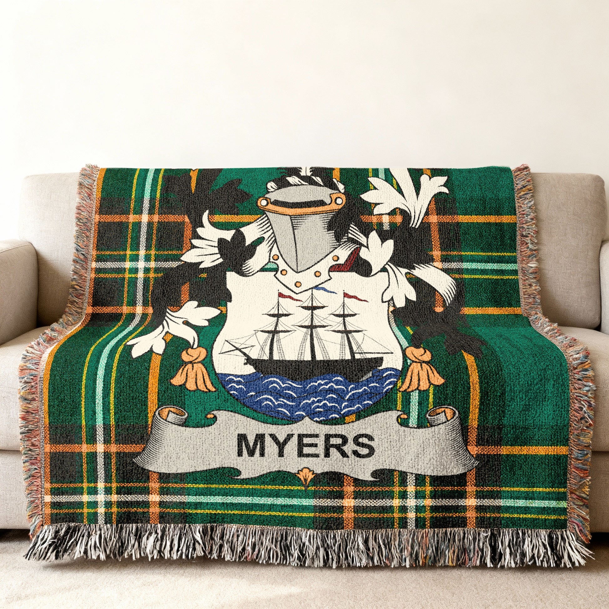 Green tartan throw blanket featuring the Myers family crest with a ship.