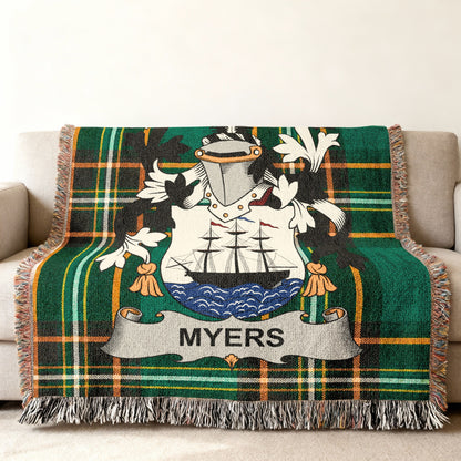 Green tartan throw blanket featuring the Myers family crest with a ship.