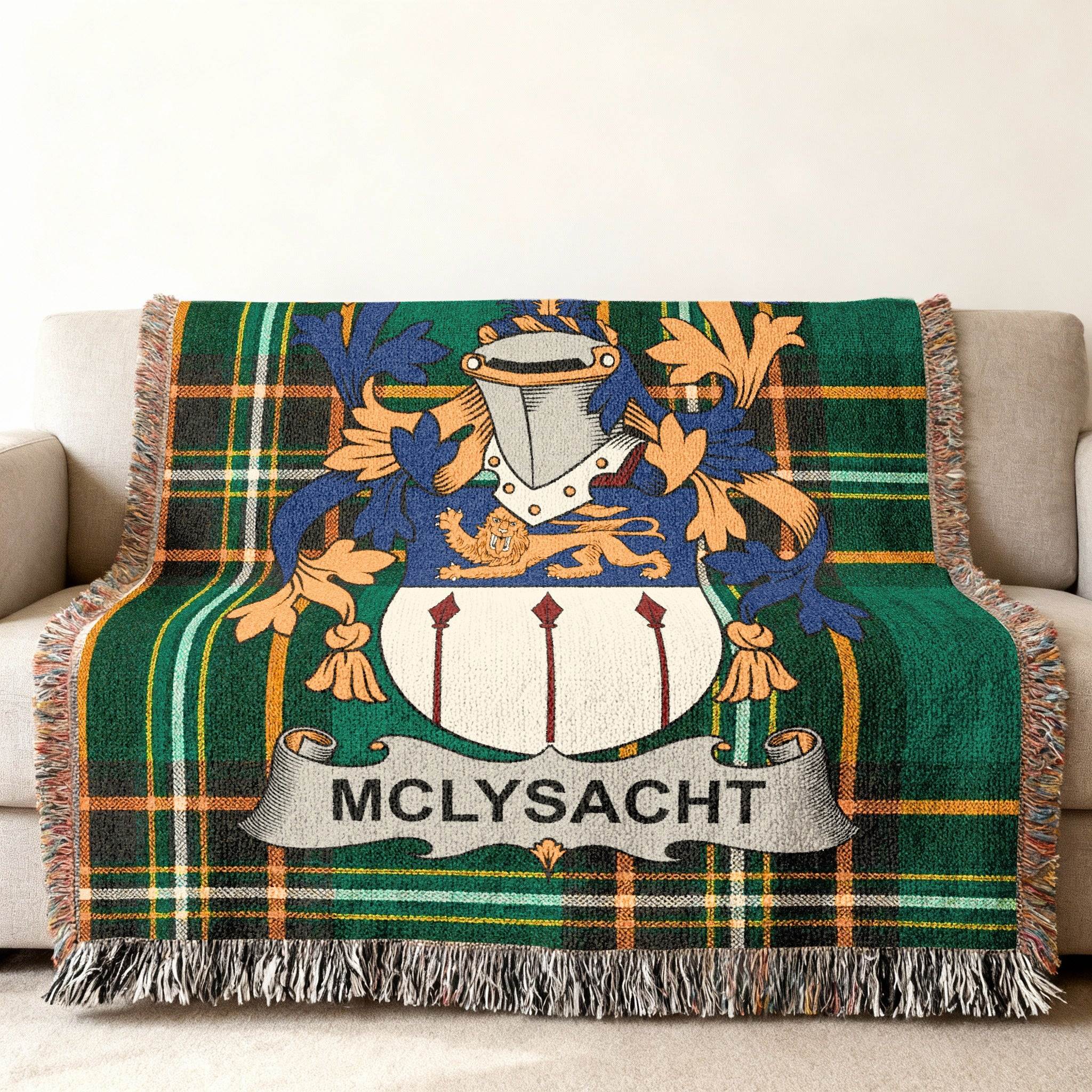 Green plaid throw blanket with the Mclysaght coat of arms centered.