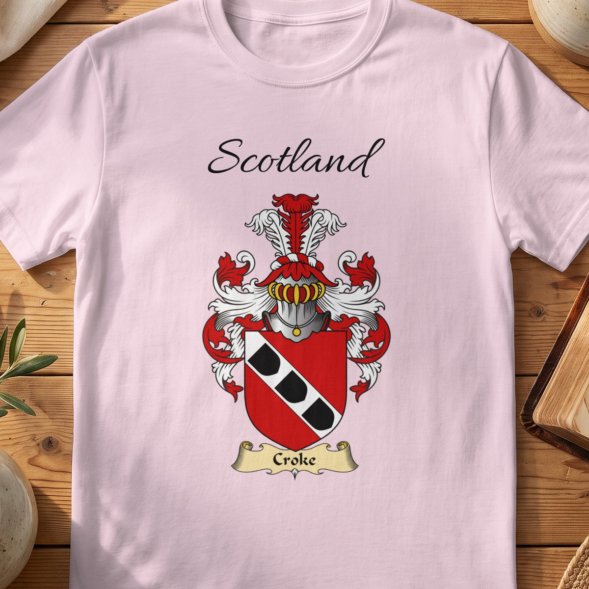 Light Pink Croke Scottish family shield T-shirt featuring a white diagonal band carrying black shield shapes