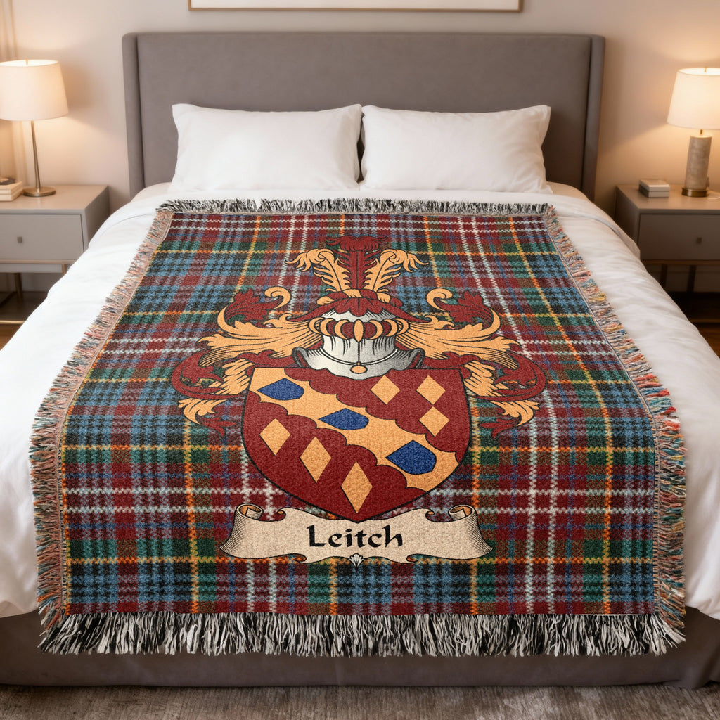 Leitch family crest emblem on a Caledonia tartan woven blanket