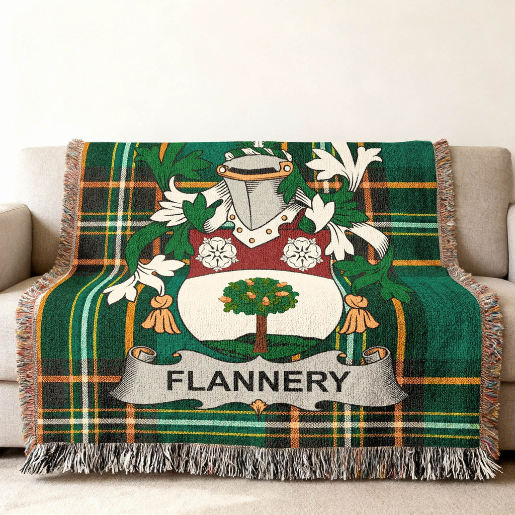 Green plaid throw blanket featuring the Flannery family crest with an oak tree.