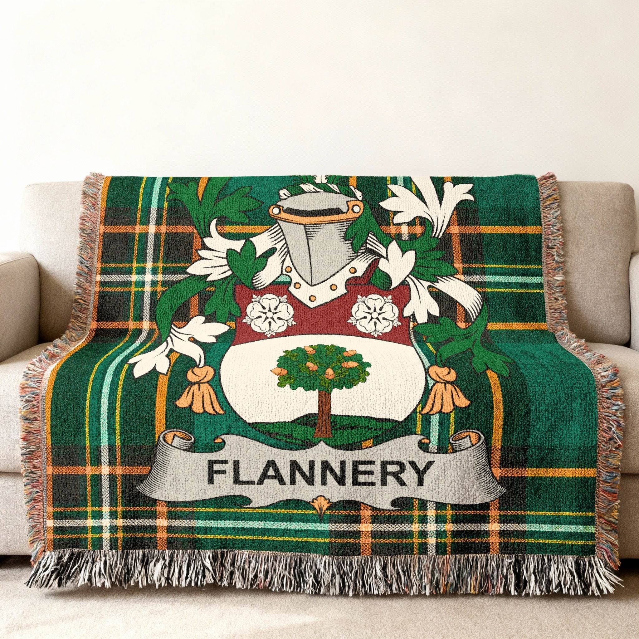 Green plaid throw blanket featuring the Flannery family crest with an oak tree.