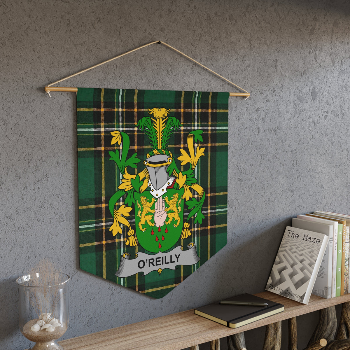 O'Reilly family crest on a green plaid pennant hanging on a wall.