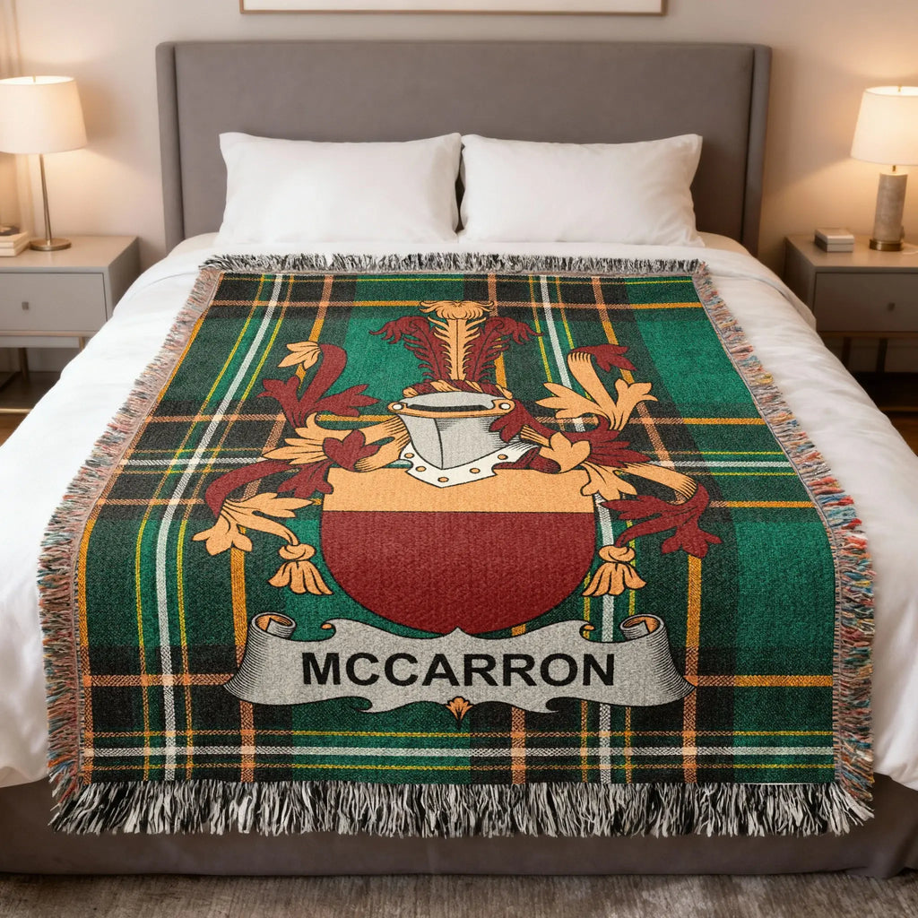 Tartan blanket with McCarron family crest and fringe.