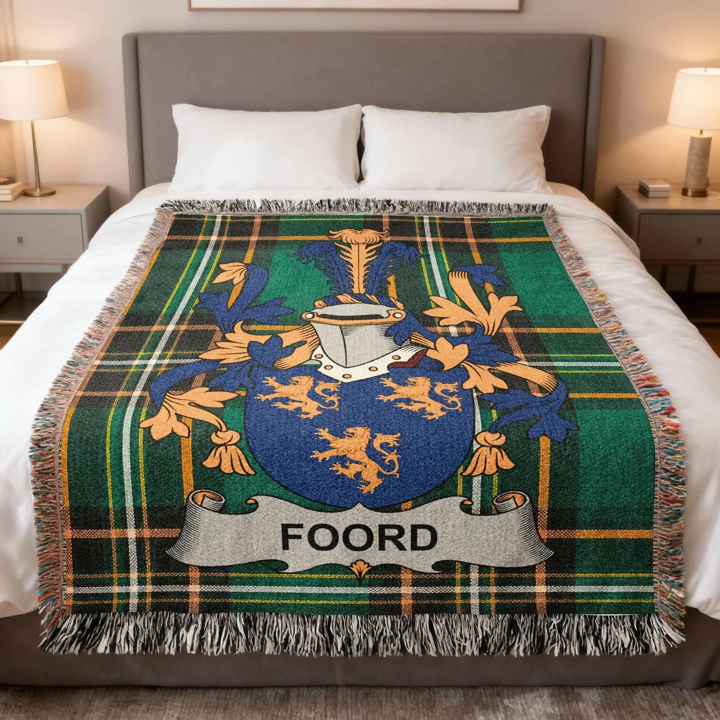 Green plaid throw blanket featuring a blue and gold coat of arms with the name FOORD.
