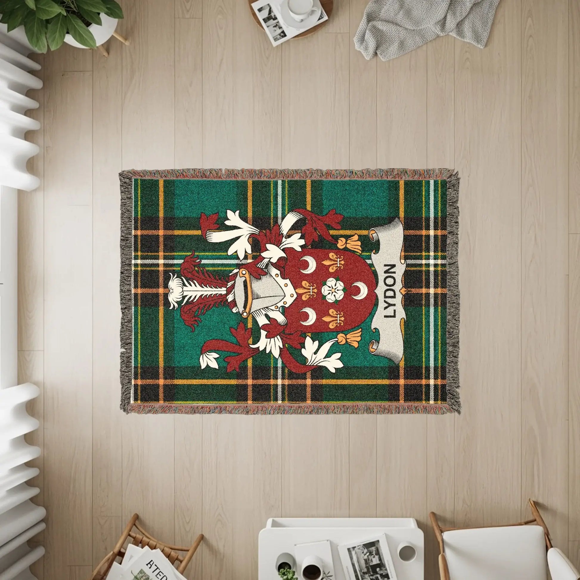 Tapestry rug with green, red, and gold plaid and the LYDON family crest.