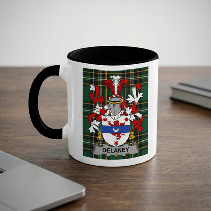 White mug with black handle displaying the Delaney family crest.