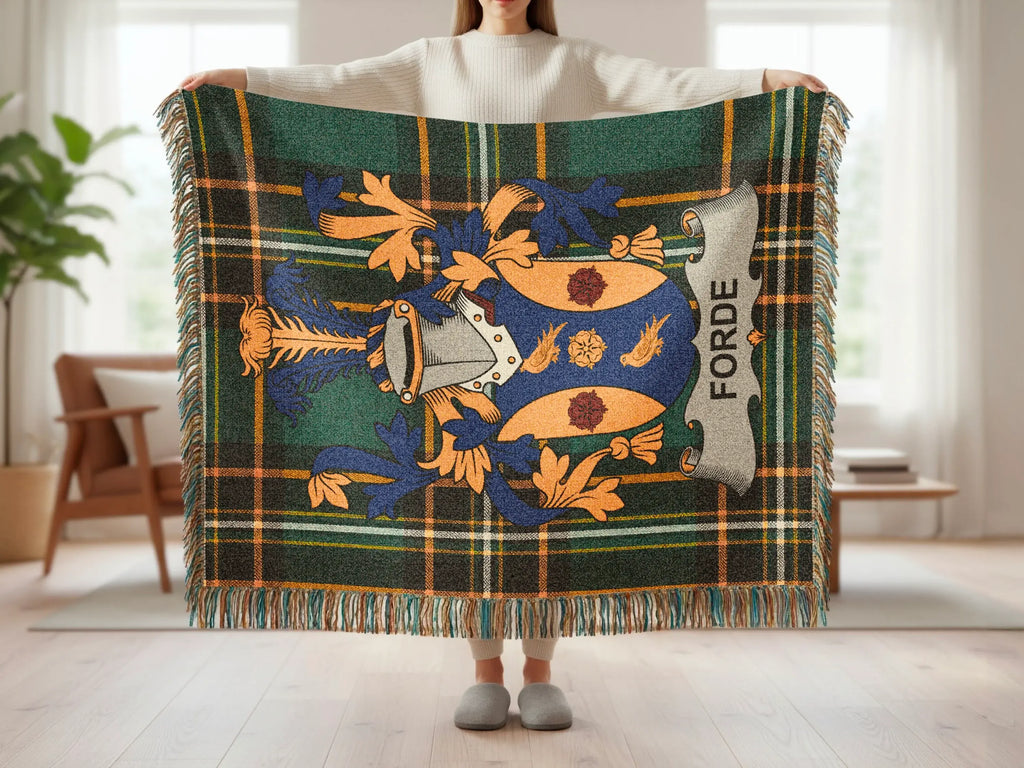 Forde clan crest on a green, blue, and yellow tartan plaid blanket.