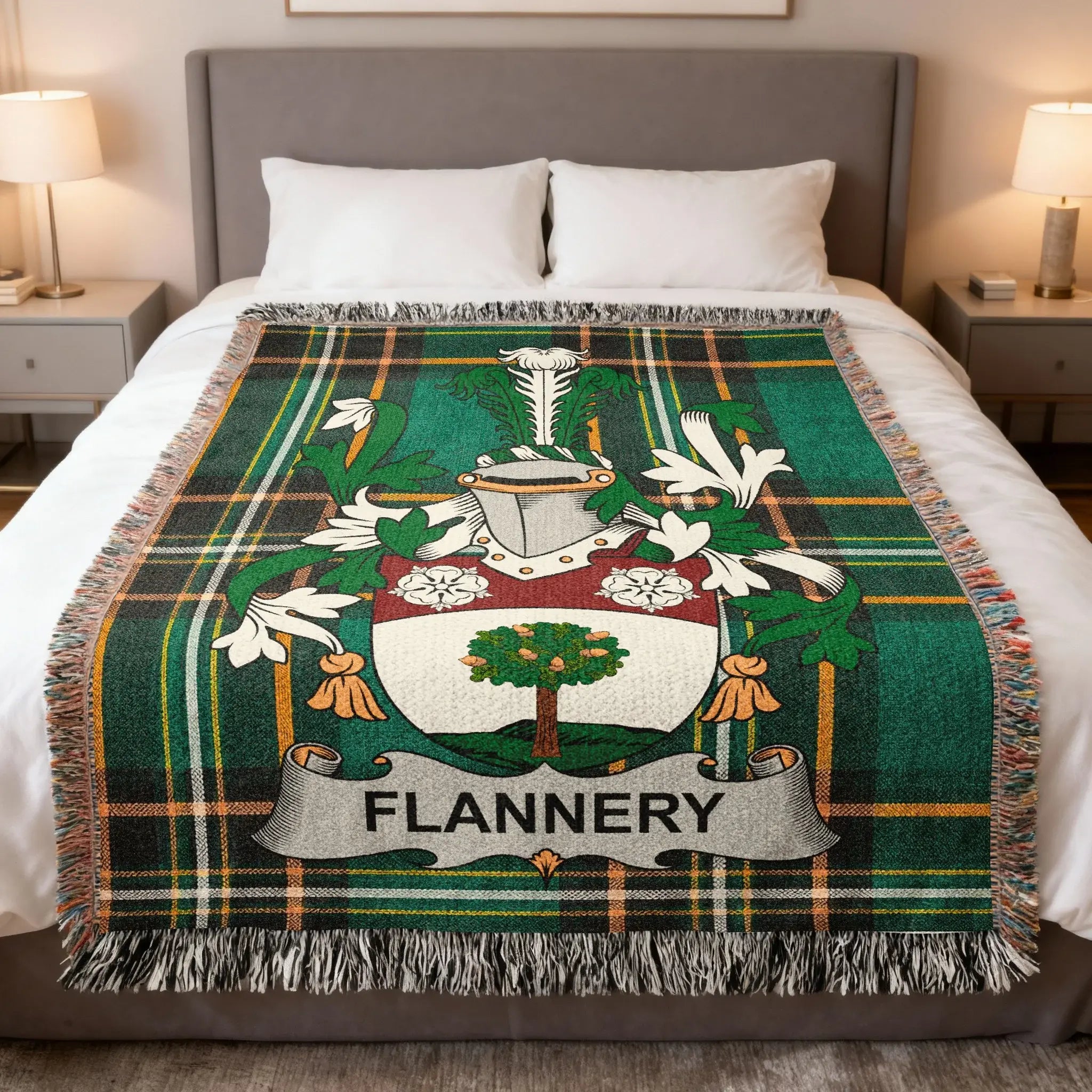Flannery family crest on a green tartan plaid throw blanket on a bed.