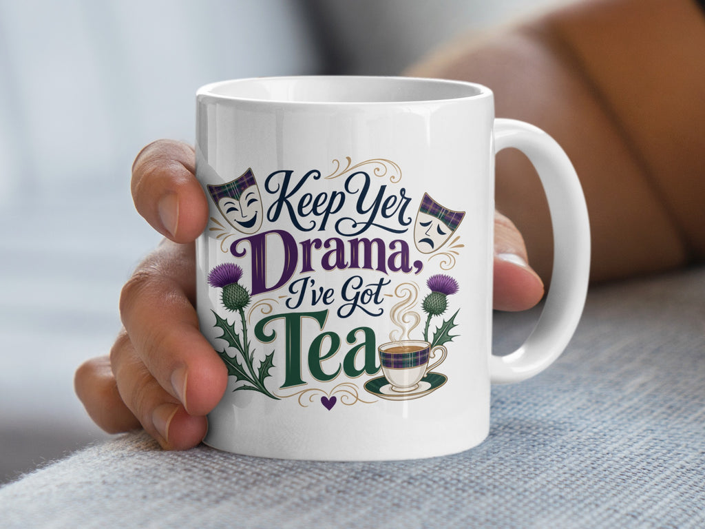 White mug with "Keep Yer Drama, I've Got Tea" text and Scottish thistle design.