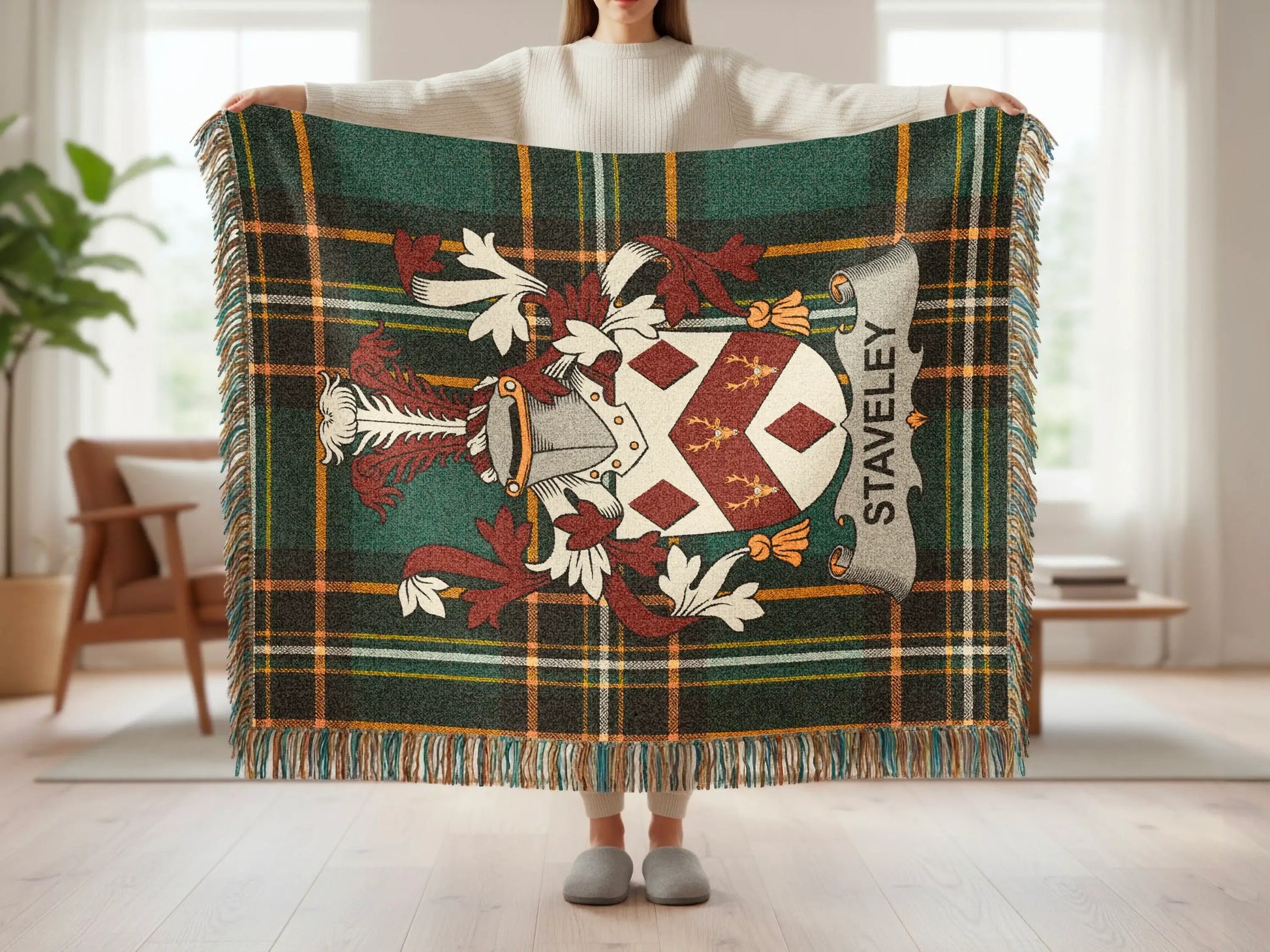 Tartan blanket with a crest and "STAVELEY" text.