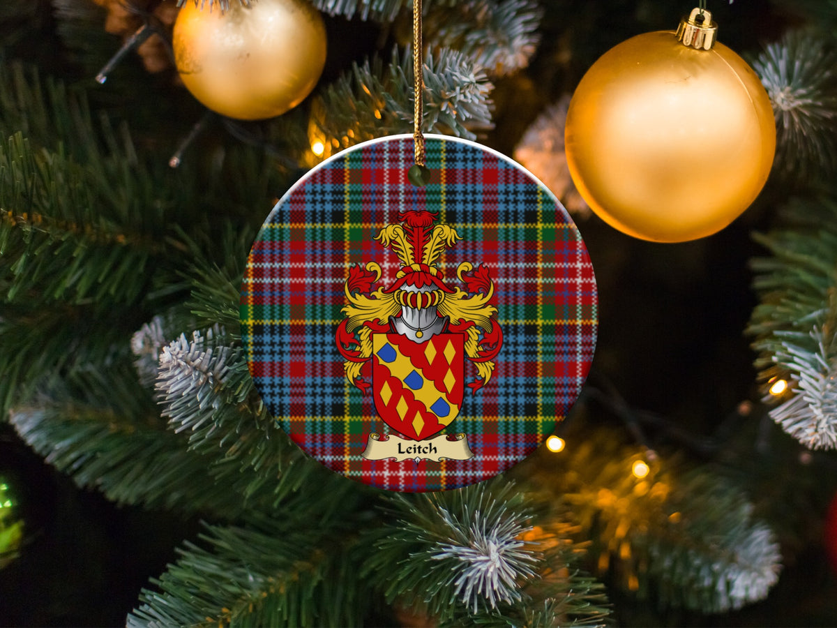 Leitch family emblem ceramic Christmas ornament with Caledonia tartan background in festive holiday décor