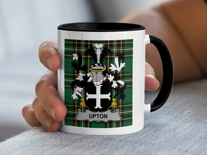 White mug with black handle displaying a green plaid crest with "UPTON" text.