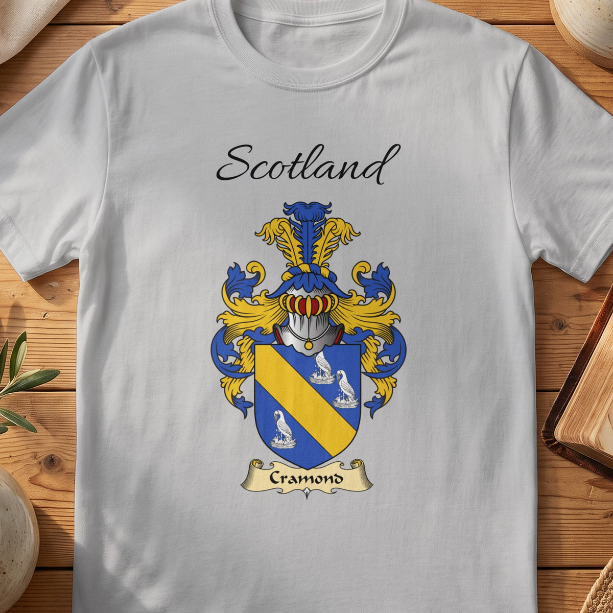 Sport Grey Cramond Scottish family shield T-shirt featuring a gold diagonal band between pale motifs on blue