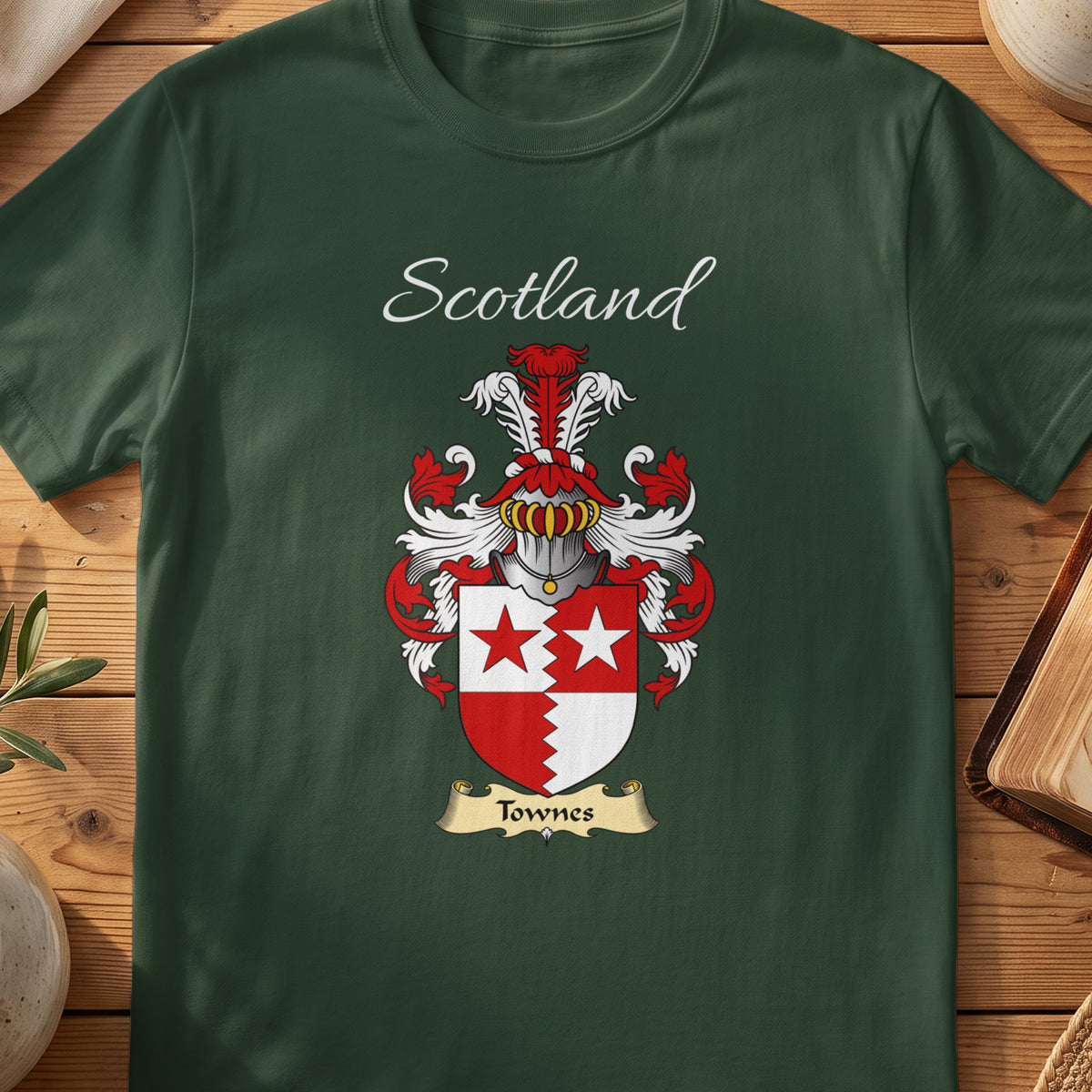 Forest Green Townes Scottish T-shirt laid flat with coat of arms artwork and “Scotland” text.