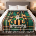 Plaid throw blanket with Langford family crest on a bed.