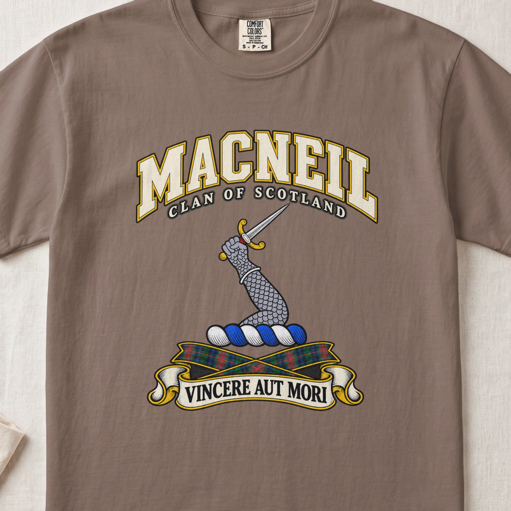 MacNeil Scottish clan T-shirt in Espresso, front view with an armoured arm holding a dagger and motto design.