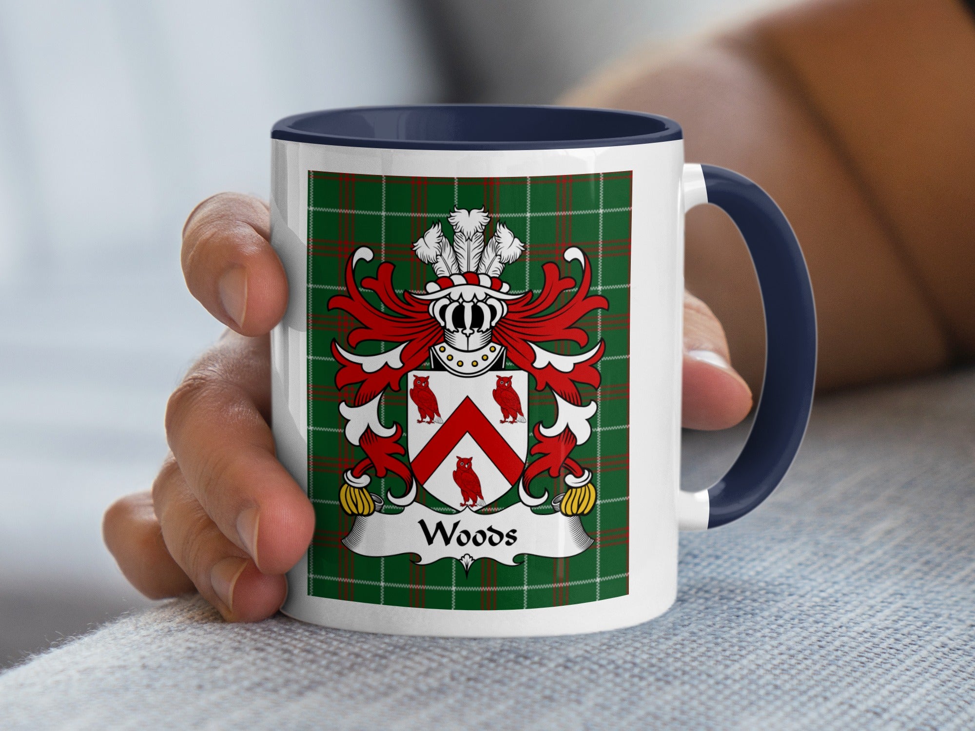 White mug with navy handle featuring the Woods family crest on a green tartan background.
