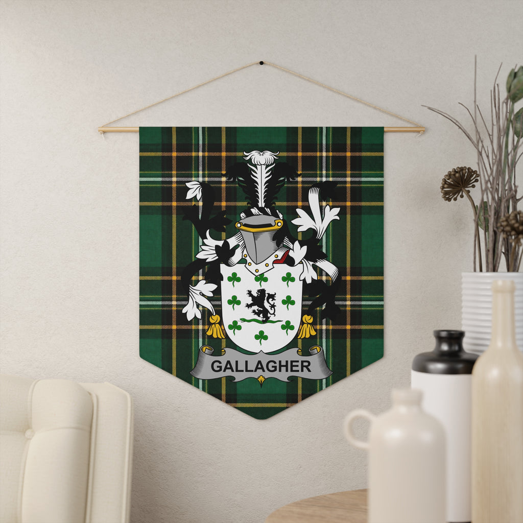 Gallagher family crest on green tartan fabric wall hanging.