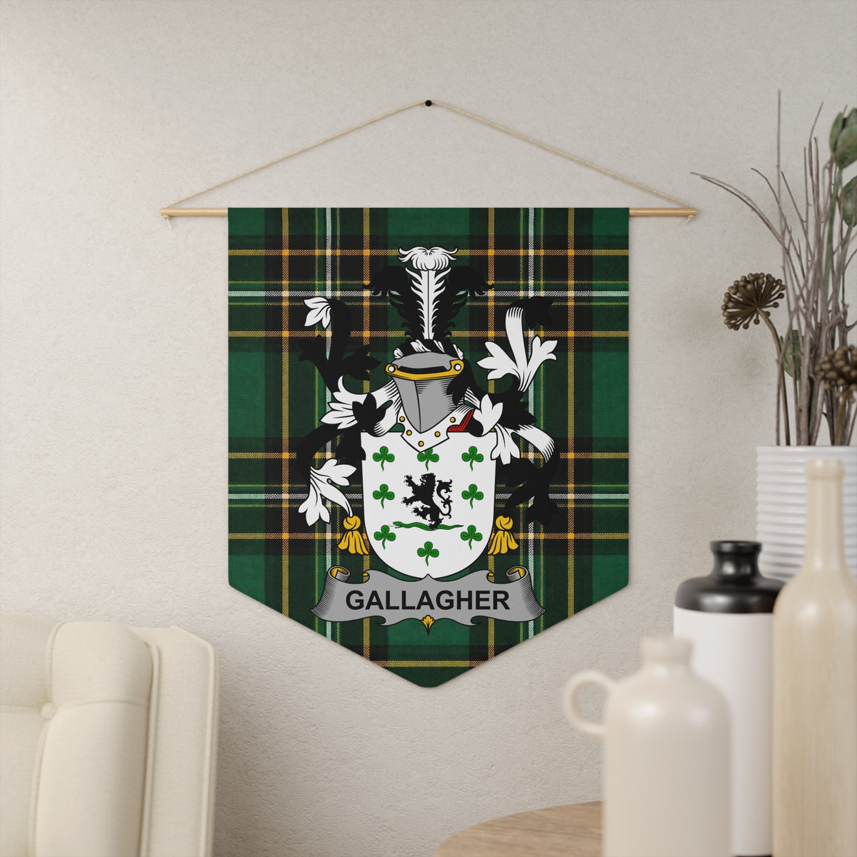 Gallagher family crest on green tartan fabric wall hanging.