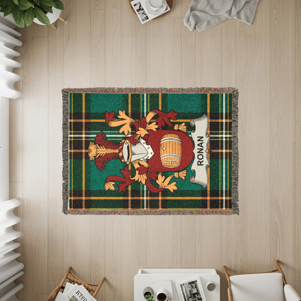Tartan rug with Ronan family crest featuring a barrel and shields.