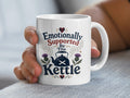 White mug with "Emotionally Supported By The Kettle" text and Scottish thistle design.