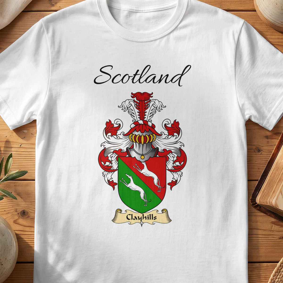 White Clayhills Scottish family shield T-shirt featuring white animals on a red-and-green shield