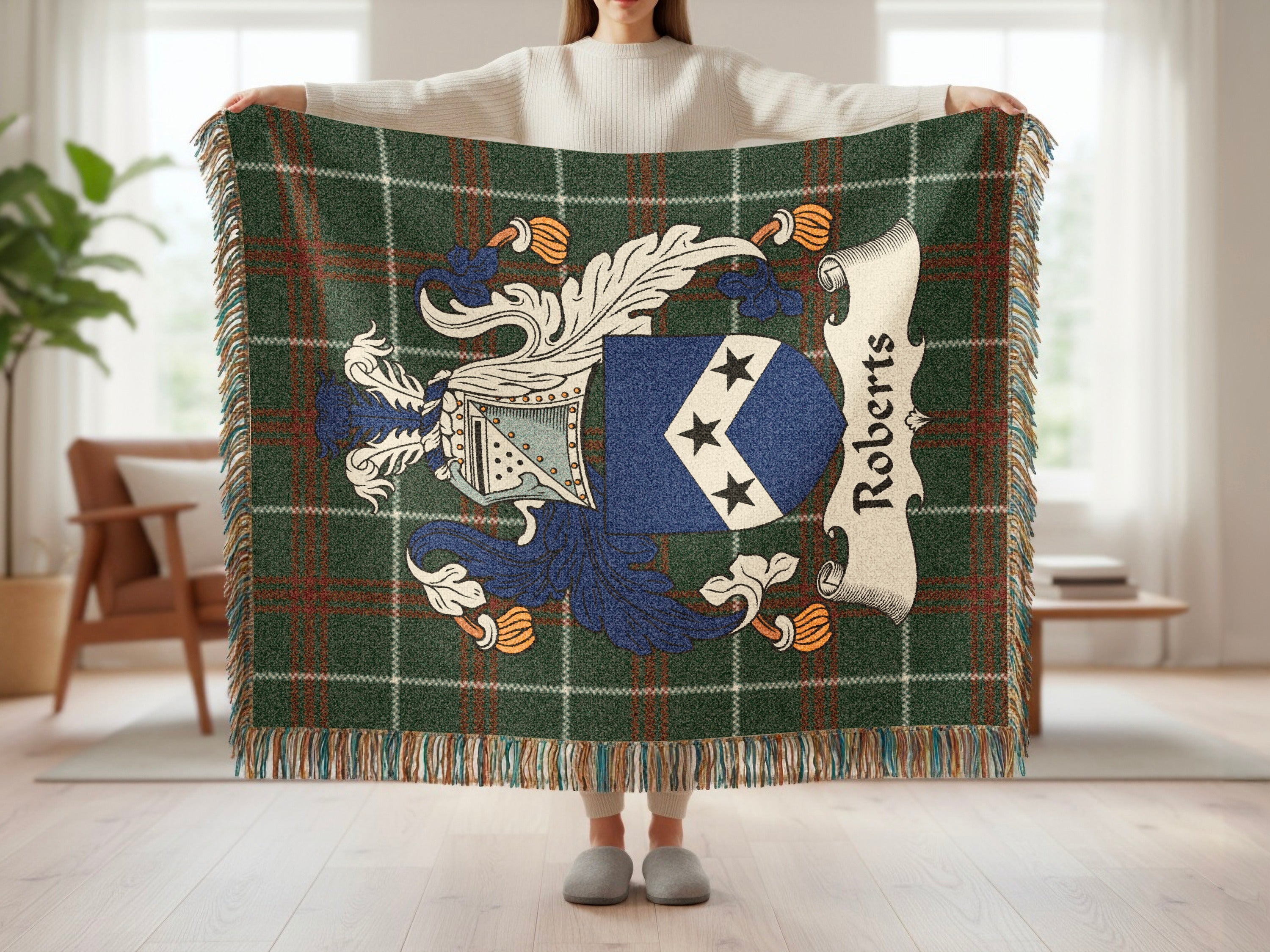 Roberts family crest on a plaid throw blanket with fringe.